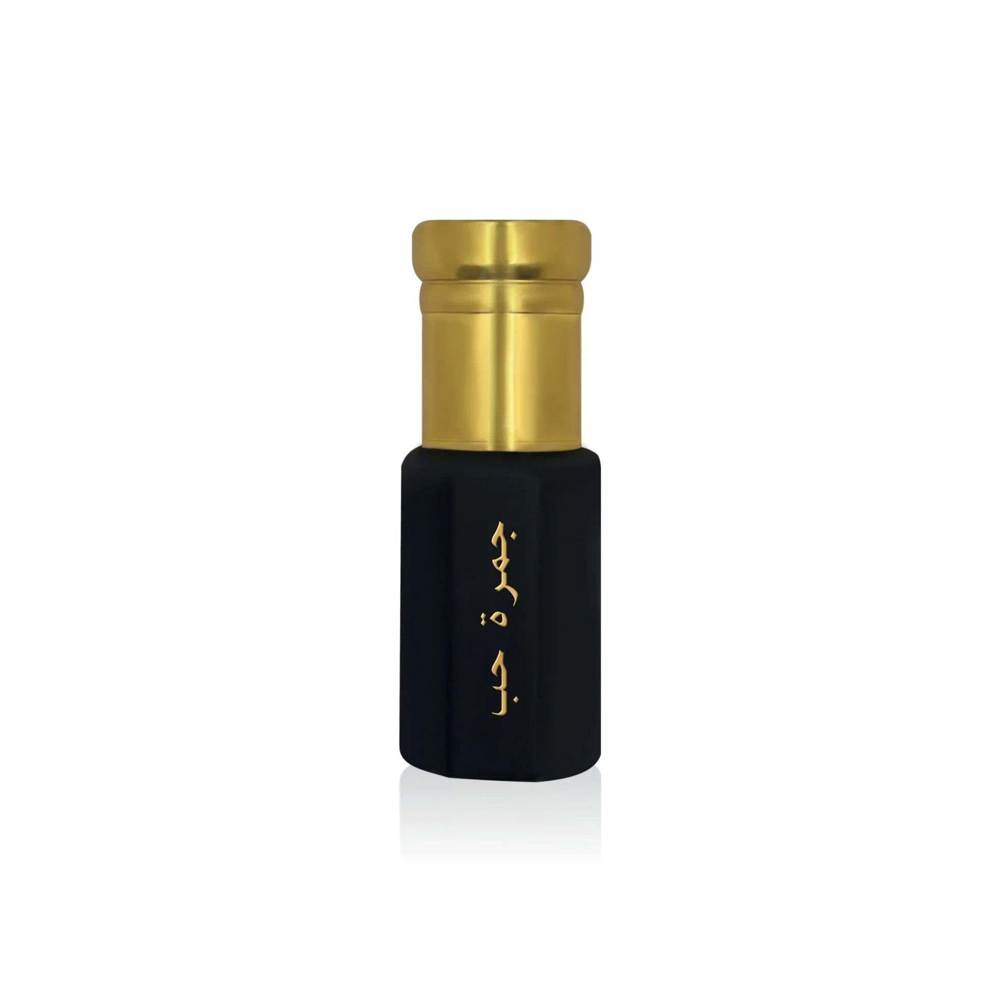 Luxury Jamr Al Oud perfume bottle with gold cap and elegant Arabic script on black.