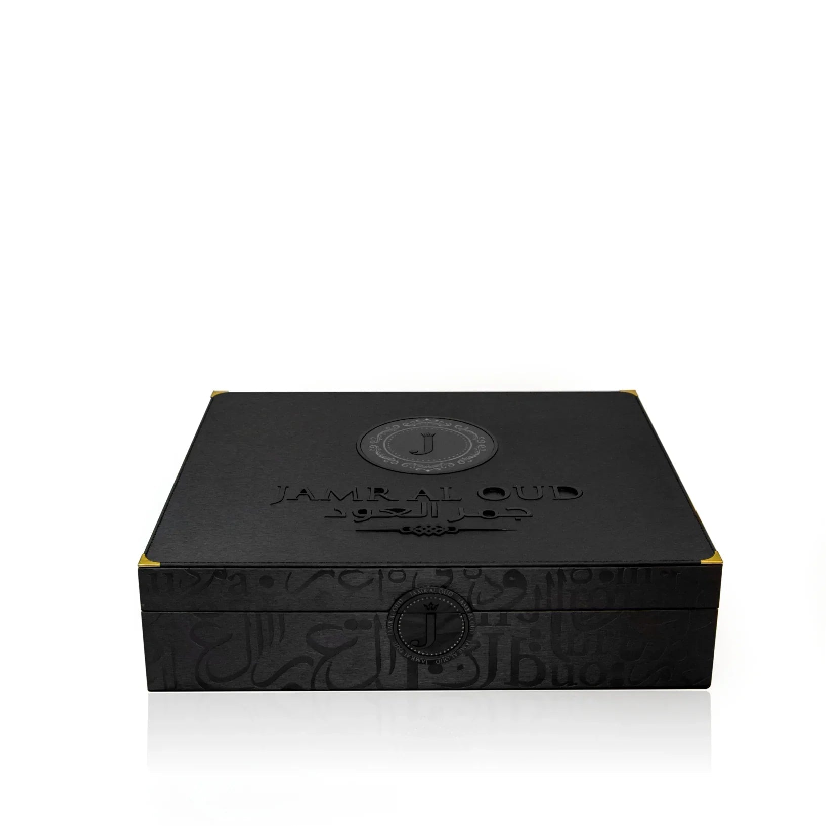 Elegant black JAMR AL OUD luxury perfume gift box with embossed branding and gold corners