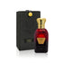 Jamr Al Oud Hawas perfume bottle with gold cap beside a black luxury gift box