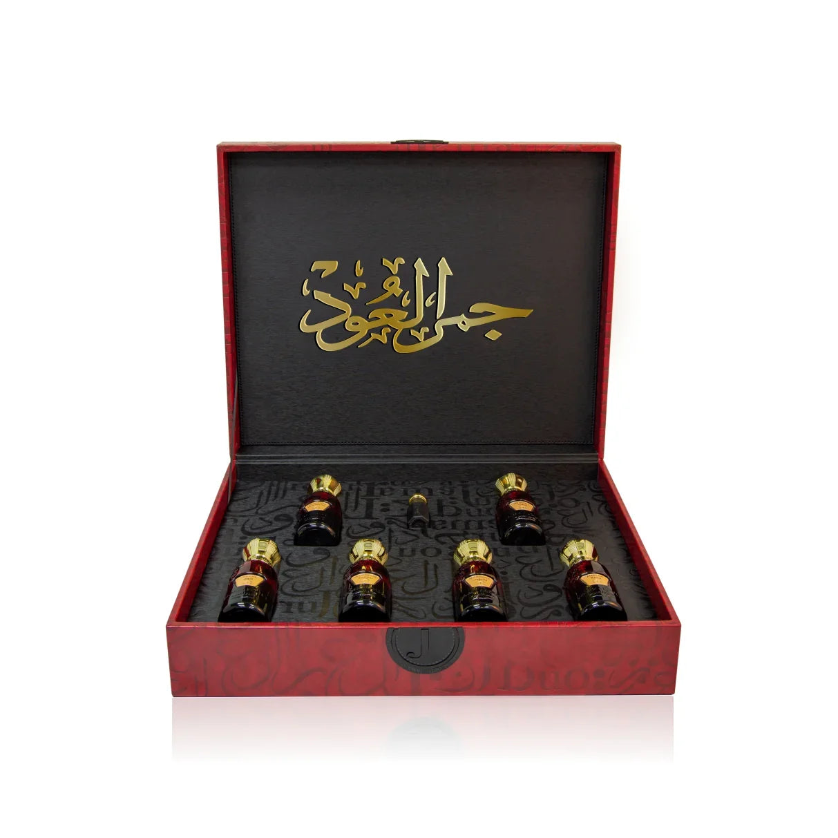 Luxury Jamr Al Oud perfume gift box with six ornate bottles and elegant Arabic script