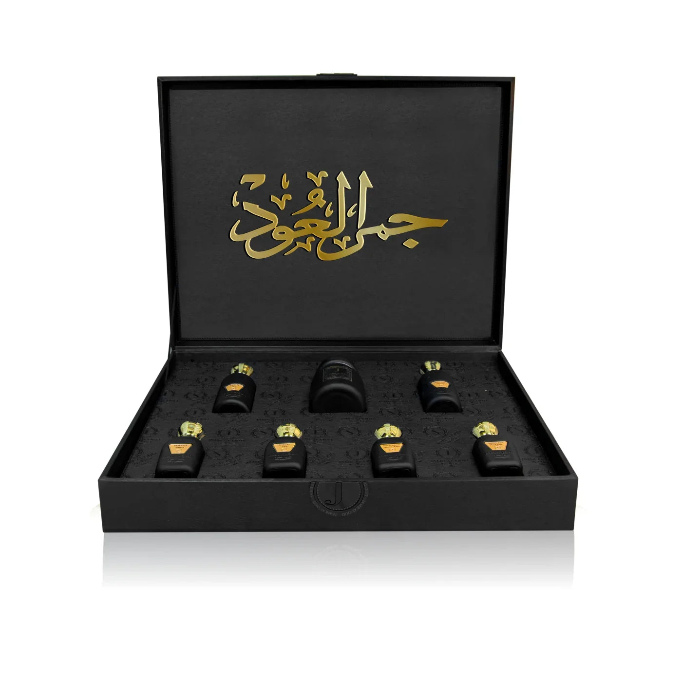 Luxury Jamr Al Oud perfumes gift box with eight elegant black and gold bottles