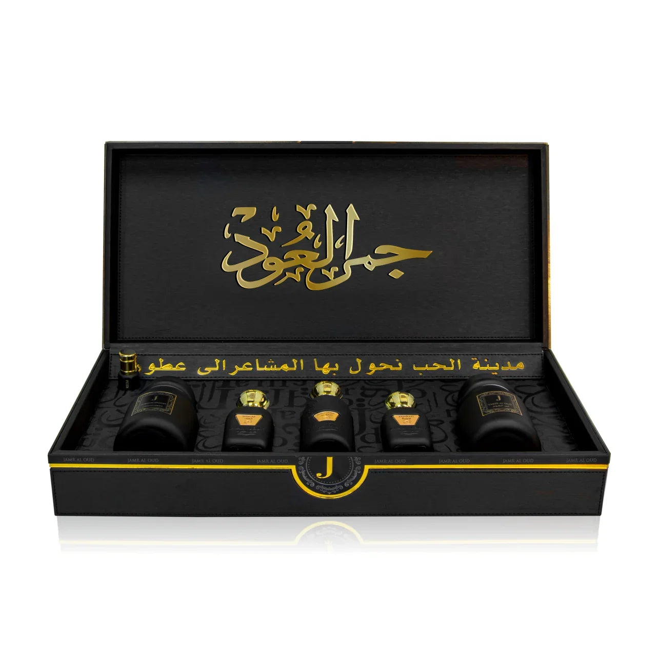Luxury Jamr Al Oud Perfumes gift box with elegant black and gold bottles displayed inside.