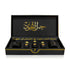 Luxury Jamr Al Oud Perfumes gift box with elegant black and gold bottles displayed inside.