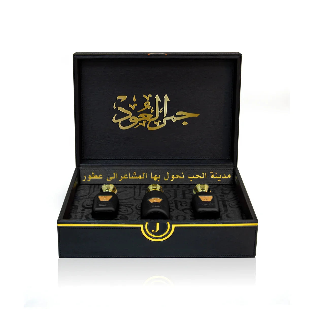 Luxury Jamr Al Oud gift box with three elegant perfume bottles, black and gold design.