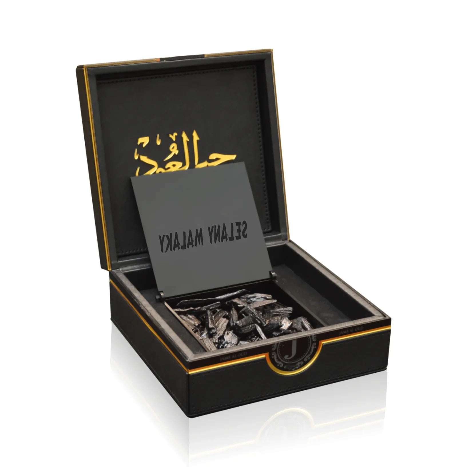 Luxury Jamr Al Oud gift box with oud wood chips and elegant gold Arabic script