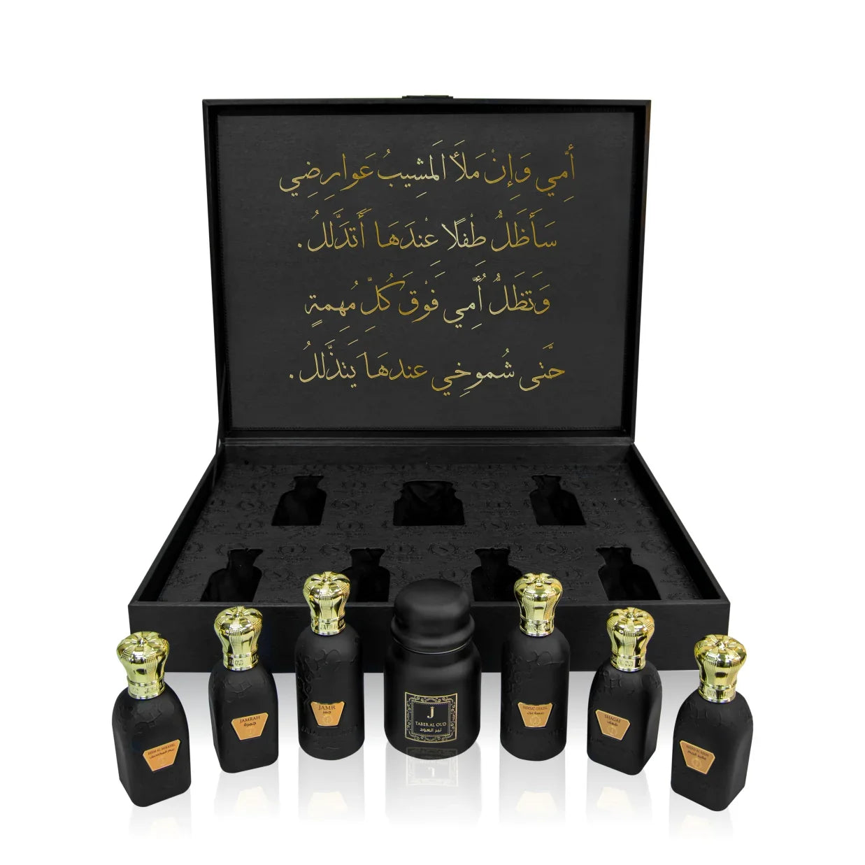 Luxury Jamr Al Oud perfumes gift box with six elegant black bottles and gold Arabic script
