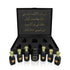 Luxury Jamr Al Oud perfumes gift box with six elegant black bottles and gold Arabic script