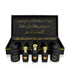 Luxury Jamr Al Oud perfume gift box set with elegant black and gold bottles and Arabic script.
