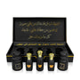 Luxury Jamr Al Oud perfume gift box set with elegant black and gold bottles and Arabic script.
