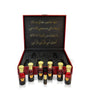 Luxury Jamr Al Oud oriental perfume set in a red gift box with gold Arabic script.