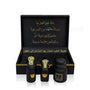 Luxury Jamr Al Oud Perfumes gift box with three elegant black and gold perfume bottles.
