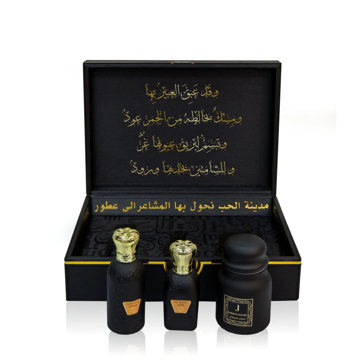 Luxury Jamr Al Oud Perfumes gift box with three elegant black and gold perfume bottles.