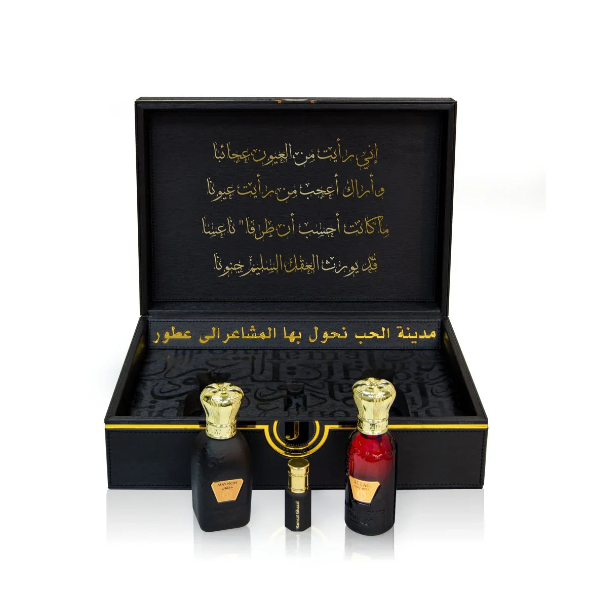 Luxury Jamr Al Oud perfume gift box with two elegant bottles and gold Arabic calligraphy.