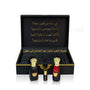 Luxury Jamr Al Oud perfume gift box with two elegant bottles and gold Arabic calligraphy.