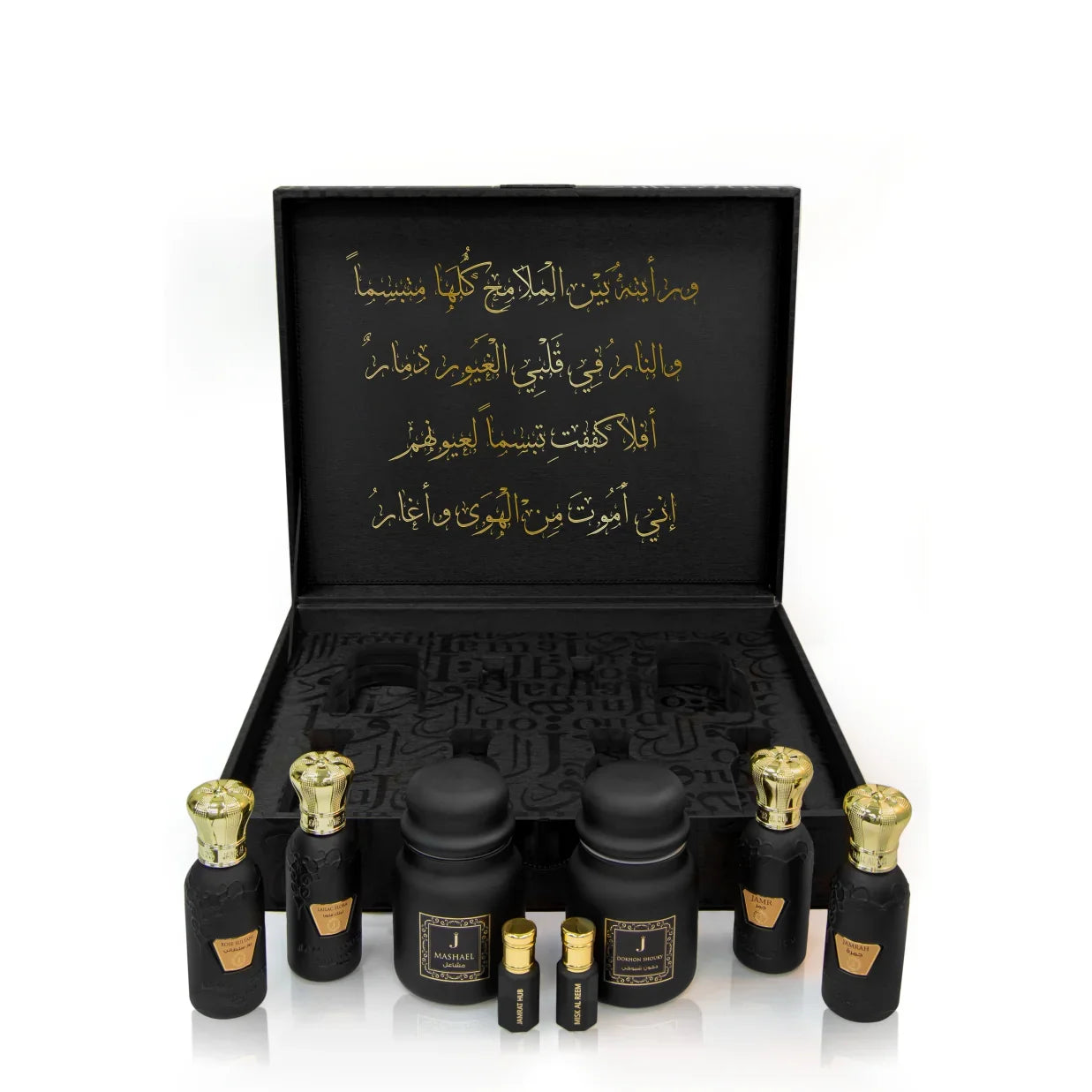 Luxury Jamr Al Oud gift box with black and gold perfume bottles and Arabic calligraphy.
