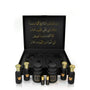 Luxury Jamr Al Oud gift box with black and gold perfume bottles and Arabic calligraphy.