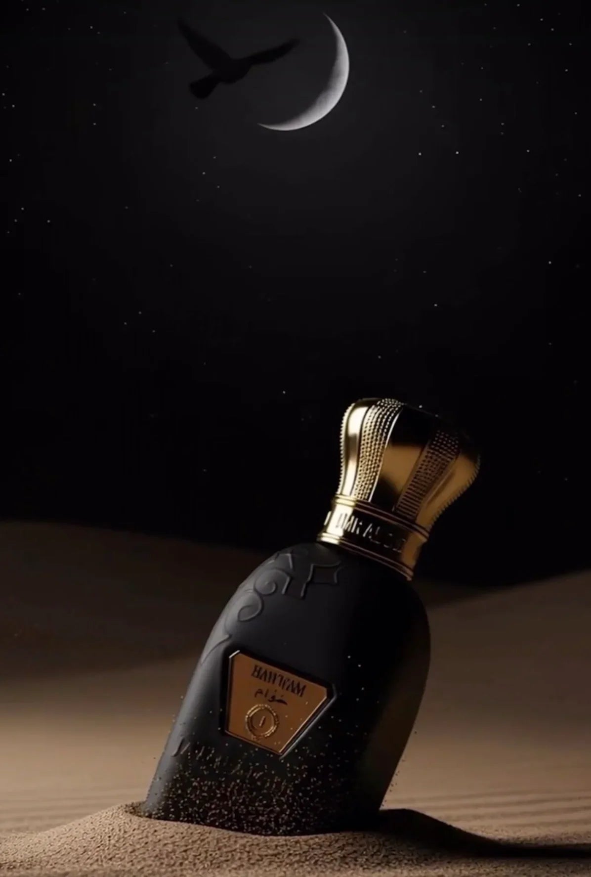 Hawwam Perfume by Jamr Al Oud, black bottle with a gold cap on sand under a crescent moon.